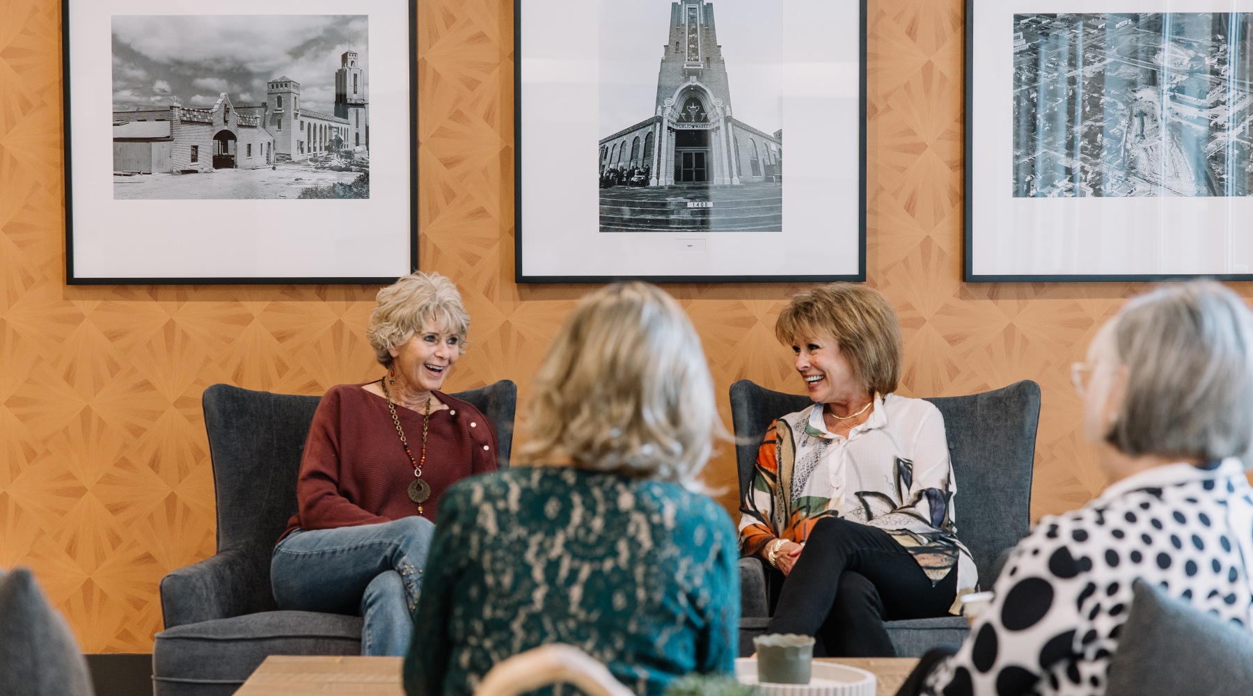 A group of active senior women chatting in the resident clubhouse at The Harden in Fort Worth